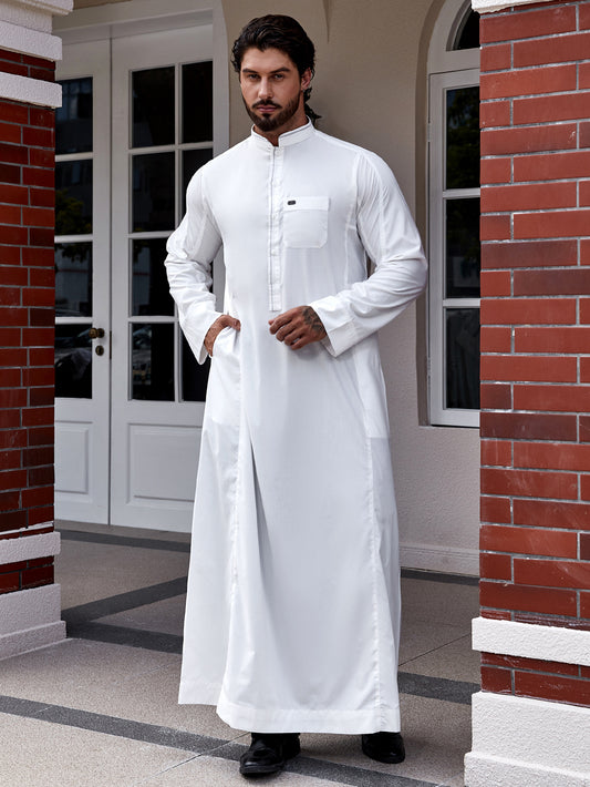 Elevate your Islamic wardrobe with our Traditional Saudi White Thobe. This authentic thobe is made from high-quality fabric and features a standard collar, long sleeves, chest buttons, and a chest pocket. Shop now at Hikmah Boutique Australia.