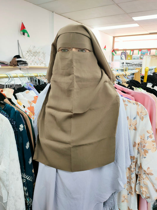 Introducing the Hikmah Boutique Triple Layer Niqab in Dusty Brown: Elevate Your Modesty with Timeless Sophistication Experience the epitome of Islamic niqabs with our exclusive Triple Layer Niqab in Dusty Brown, meticulously crafted to meet the discerning needs of modest fashion enthusiasts. 