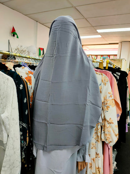 Introducing the Hikmah Boutique Triple Layer Niqab in Grey: Elevate Modesty with Subtle Sophistication Enter the world of Islamic niqabs with our exclusive Triple Layer Niqab in Grey, meticulously crafted for those seeking modest fashion with a touch of modern elegance.