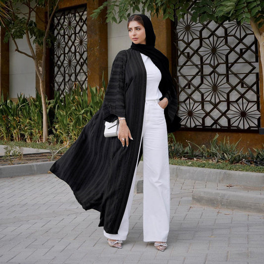 Embrace classic elegance with our Black Vintage Summer Open Abaya. This versatile piece is perfect for any occasion. Shop now and elevate your modest wardrobe.