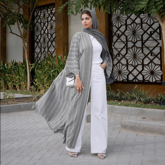 Discover Muslim Clothing elegance with our Pearl Grey Vintage Summer Open Abaya. This open abaya is perfect for warm days. Shop now and experience the luxury of modest fashion.