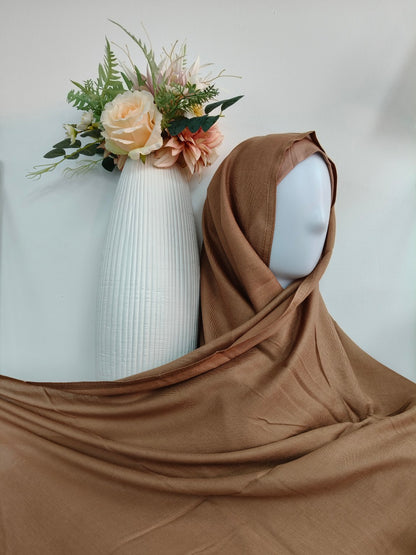 Discover our collection of stylish hijab sets, perfect for those who want to stay fashionable while maintaining modesty. This set feature trendy designs and Chocolate Brown color that complement any outfit, ensuring you look chic every day.