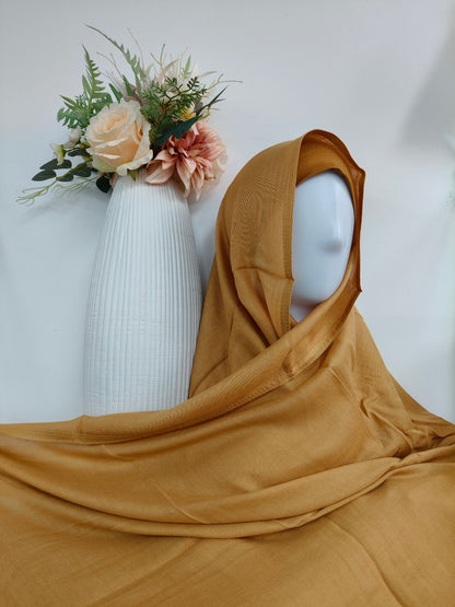 Enhance your hijab collection by purchasing matching jersey hijab and undercap sets. These sets provide comfort, style, and a secure fit, ensuring you look your best throughout the day.