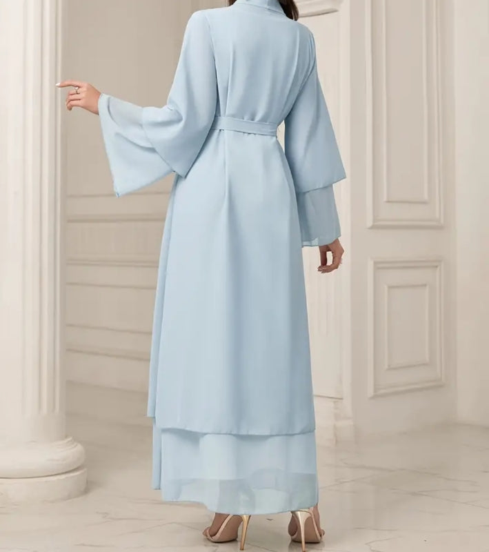 Elevate your modest elegance with the Vista Blue Open Abaya With Hijab by Hikmah Boutique. Crafted from luxurious chiffon, this designer abaya offers versatile style and timeless grace. Available in various sizes. Explore the epitome of Islamic fashion today.