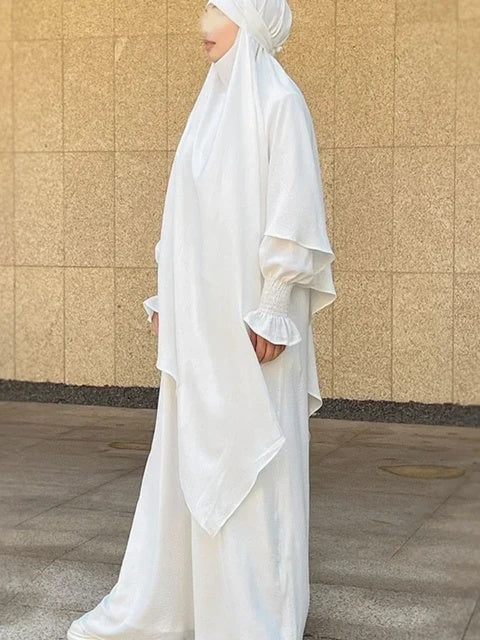 Shop Modest Clothing with our White Crepe Crinkle Abaya with Double Layer Khimar Set, a Timeless Modesty at Hikmah Boutique. Embrace the purity of style with our White Crepe Crinkle Abaya with Double Layer Khimar Set, an embodiment of timeless modesty and sophistication exclusively available at Hikmah Boutique.