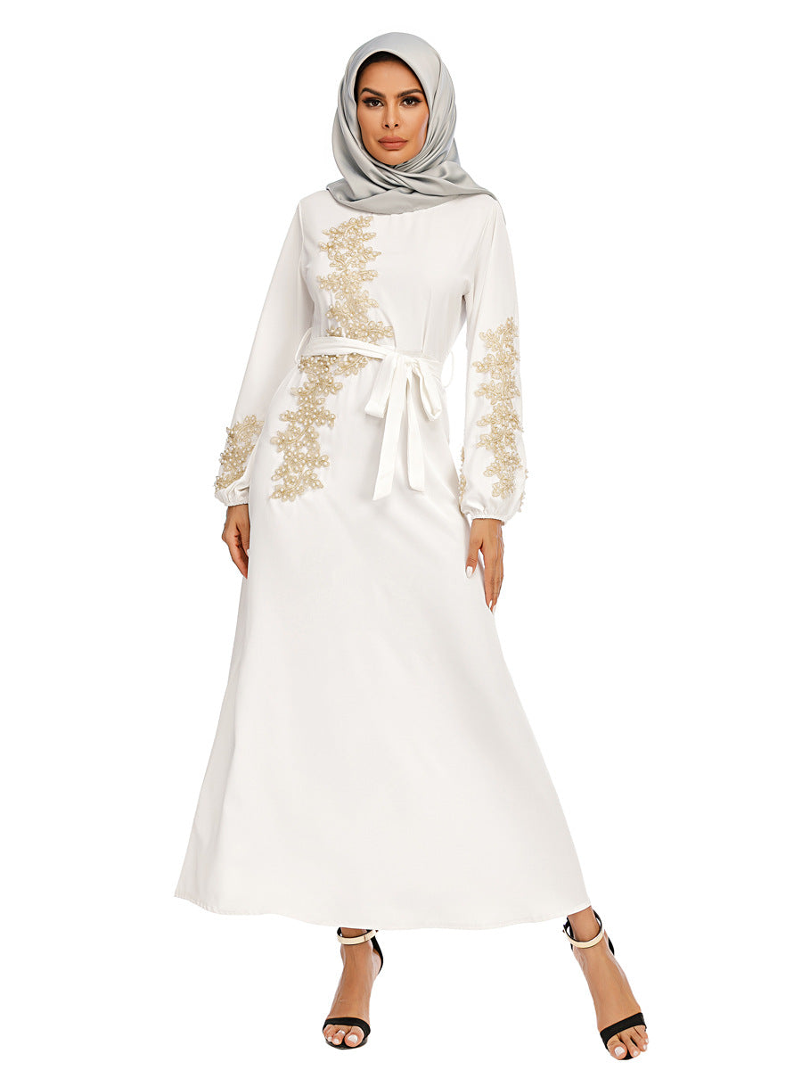 Discover the White Pearl Abaya with golden pearls and a removable belt at Hikmah Boutique. Perfect for special occasions and everyday wear. Shop stylish, affordable, and luxury abayas now!