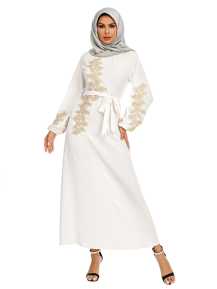 Discover the White Pearl Abaya with golden pearls and a removable belt at Hikmah Boutique. Perfect for special occasions and everyday wear. Shop stylish, affordable, and luxury abayas now!