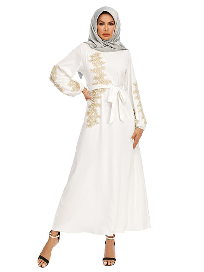 Discover the White Pearl Abaya with golden pearls and a removable belt at Hikmah Boutique. Perfect for special occasions and everyday wear. Shop stylish, affordable, and luxury abayas now!