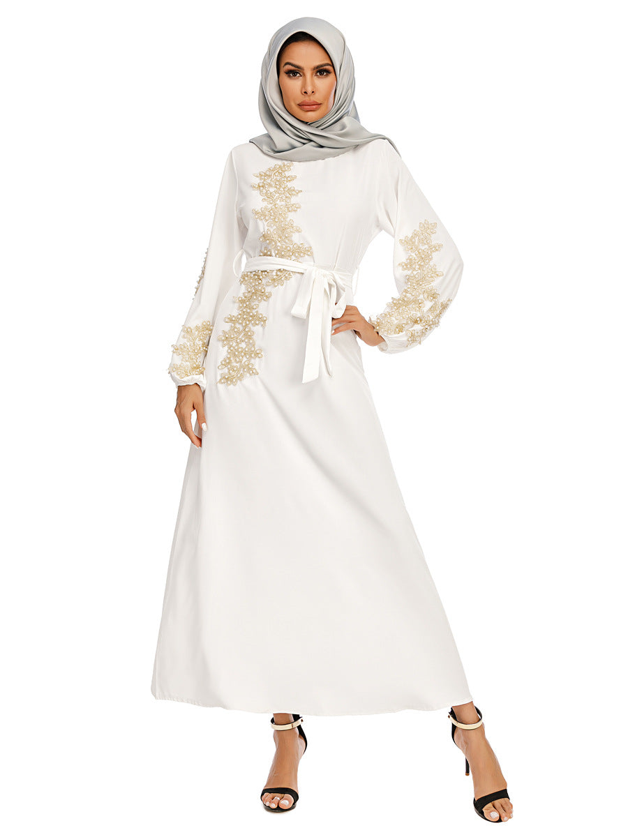 Discover the White Pearl Abaya with golden pearls and a removable belt at Hikmah Boutique. Perfect for special occasions and everyday wear. Shop stylish, affordable, and luxury abayas now!