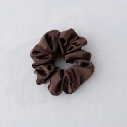 Indulge in the luxurious softness of our 100% silk scrunchies, our silk scrunchies designed to elevate your hair styling routine. Made from the finest quality 100% silk, these scrunchies offer an incredibly gentle and silky-smooth touch that helps minimize hair breakage. Silk Scrunchies keep hair looking pristine. 