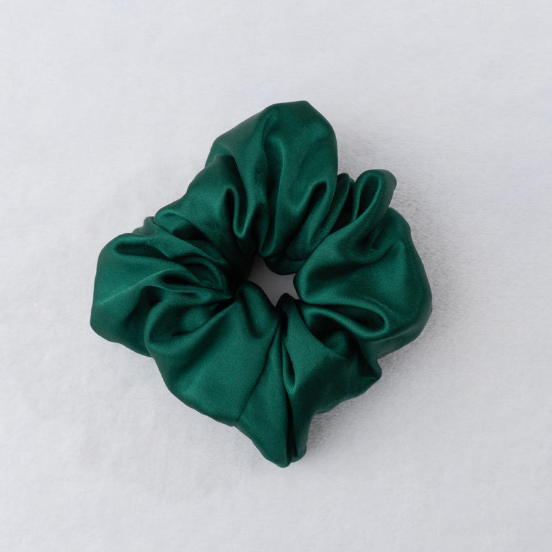 Indulge in the luxurious softness of our 100% silk scrunchies. Our silk scrunchies designed to elevate your hair styling routine. Made from the finest quality 100% silk, these scrunchies offer an incredibly gentle and silky-smooth touch that helps minimize hair breakage. Silk Scrunchies keep hair looking pristine. 