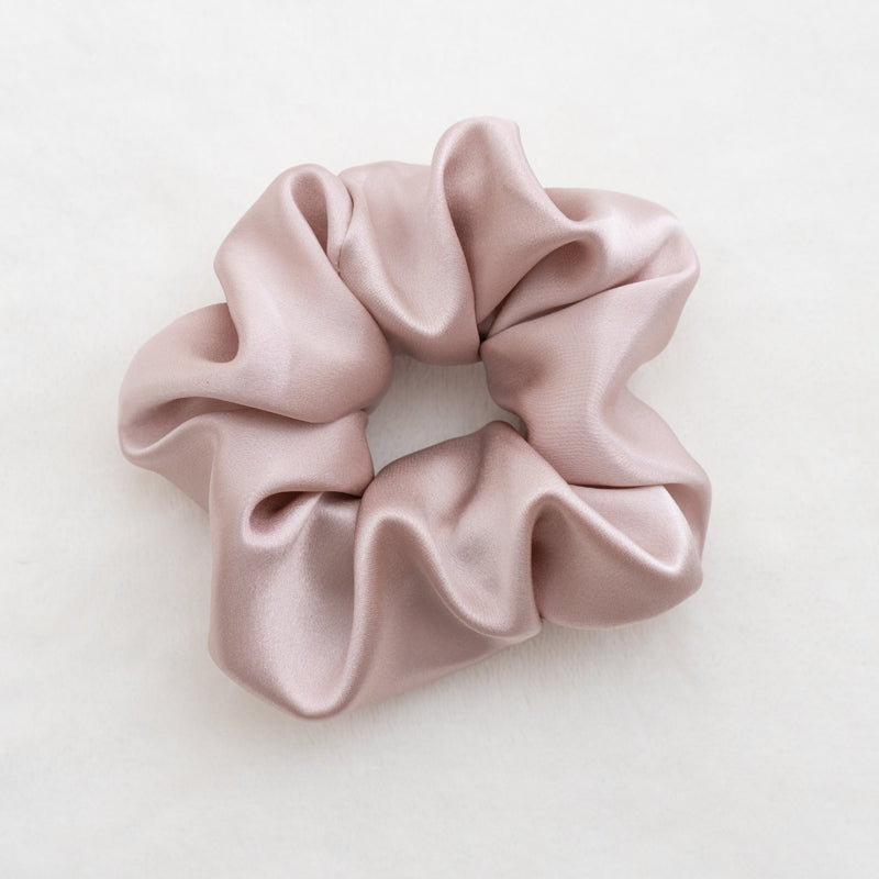 Indulge in the luxurious softness of our 100% silk scrunchies, designed to elevate your hair styling routine. Made from the finest quality 100% silk, these scrunchies offer an incredibly gentle and silky-smooth touch that helps minimize hair breakage and keep your tresses looking pristine. Available in 3.5cm & 6cm.