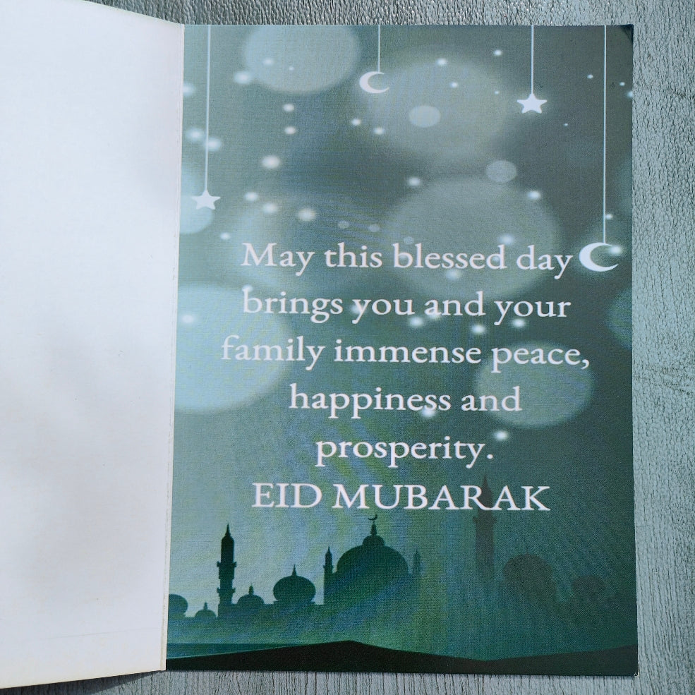 Introducing the exquisite Eid Greeting Card by Hikmah Boutique - a true masterpiece crafted with love and care, designed to convey your heartfelt wishes during the joyous occasion of Eid. This stunning card is a perfect blend of artistry and elegance, making it a memorable way to extend your warmest greetings to your loved ones. 