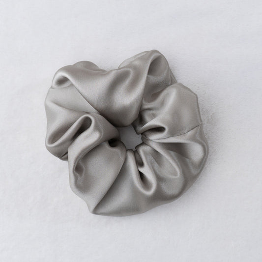 Indulge in the luxurious softness of our 100% silk scrunchies. Our Silk Scrunchies designed to elevate your hair styling routine. Made from the finest quality 100% silk, these scrunchies offer an incredibly gentle and silky-smooth touch that helps minimize hair breakage. Silk Scrunchies keep hair looking pristine. 