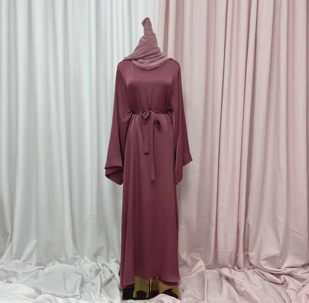 Explore our exquisite satin abaya at Hikmah Boutique. Discover the perfect blend of luxury and comfort with our range of elegantly designed satin abayas. Elevate your modest fashion with the allure of satin's texture!