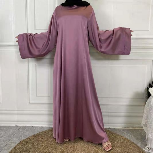 Explore our exquisite satin abaya at Hikmah Boutique. Discover the perfect blend of luxury and comfort with our range of elegantly designed satin abayas. Elevate your modest fashion with the allure of satin's texture!